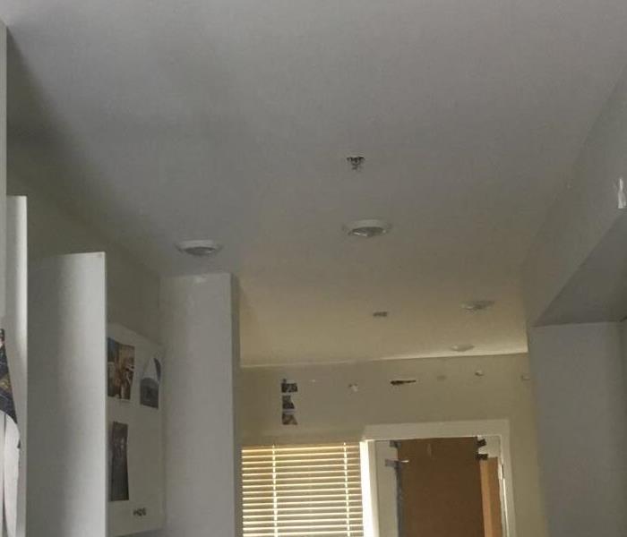 black soot above the kitchen area that has kitchen equipment